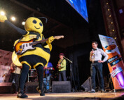 Beesly playing guitar at the WISciVariety show in 2025